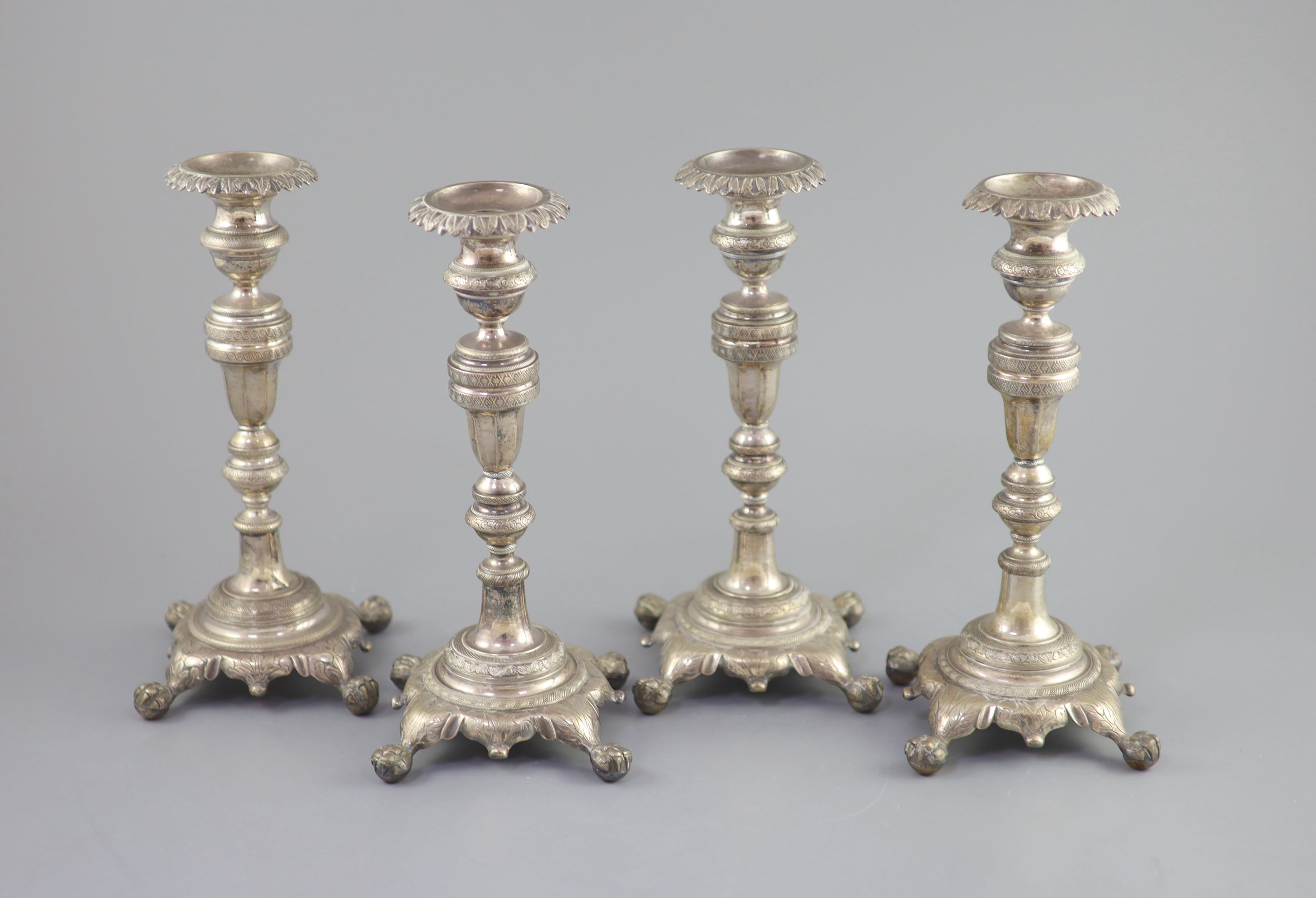 A set of four early 19th century South American? cast silver candlesticks